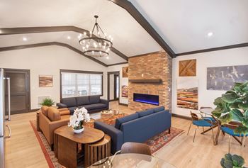 the preserve at ballantyne commons living room with couches and a fireplace
